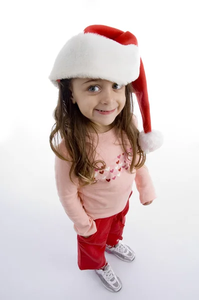 Stoi mała dziewczynka kapelusz Boże Narodzenie — Zdjęcie stockowe
