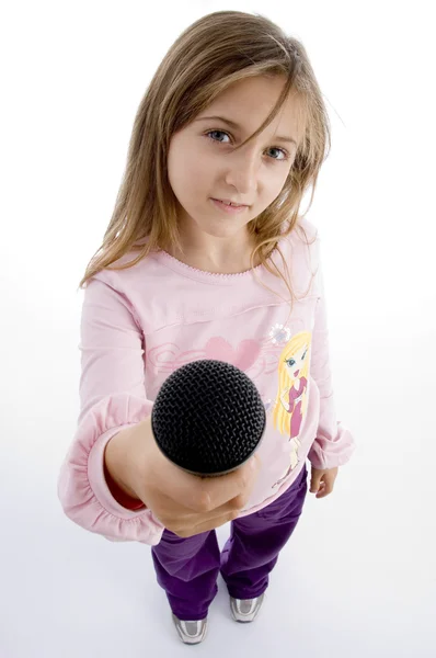 Menina inocente mostrando microfone — Fotografia de Stock