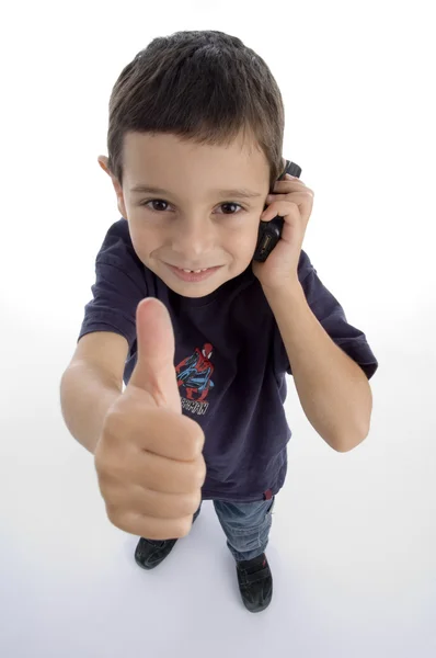 Rozkošný chlapec zaneprázdněn na telefonní hovor — Stock fotografie