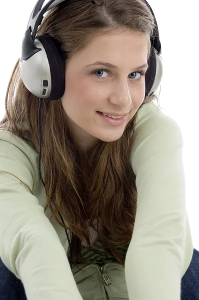 Close up of pretty female enjoying music — Stock Photo, Image