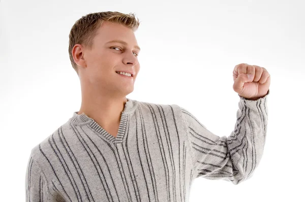 Joven guapo mostrando su puño — Foto de Stock