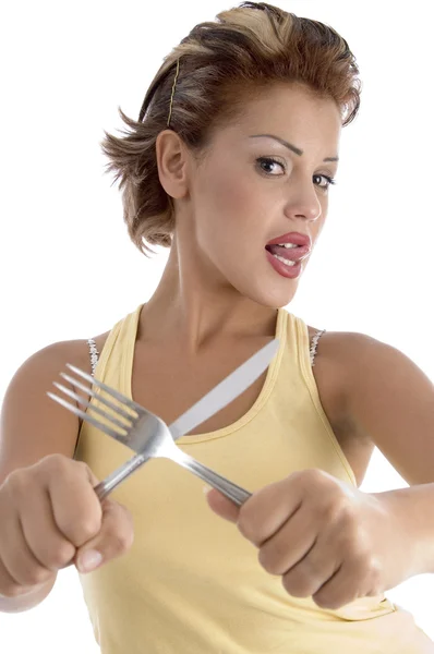 Giovane donna in posa con forchetta e coltello — Foto Stock