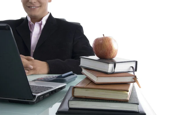 Businessman with apple and books — Stock Photo, Image