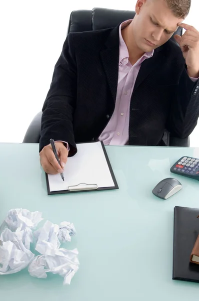 Businessman writing on paper pad — Stock Photo, Image