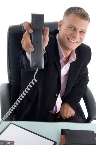 Happy businessman showing receiver — Stock Photo, Image