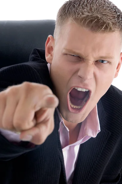 Angry businessman pointing at camera — Stock Photo, Image