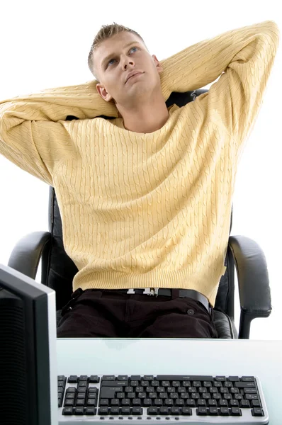 Handsome young executive sitting idle — Stock Photo, Image