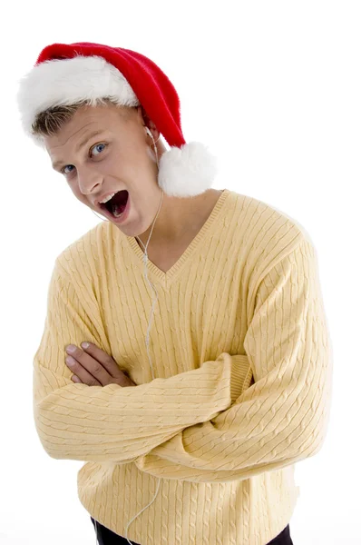 Чоловік з різдвяним капелюхом і телефоном каналу — стокове фото