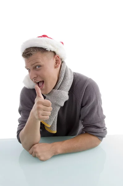 Man with christmas hat showing thumb up — Stock Photo, Image