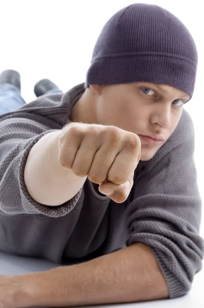 Model with winter cap showing punch — Stock Photo, Image