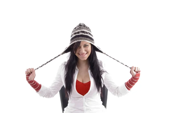 Pretty girl stretching her woolen cap — Stock Photo, Image
