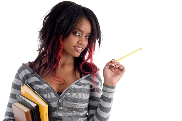 Школьная девушка позирует с карандашом и книгами — стоковое фото