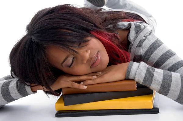 Cansada menina da escola dormindo em seus livros — Fotografia de Stock