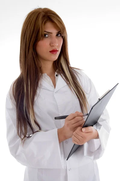 Pretty doctor posing with writing board — Stock Photo, Image