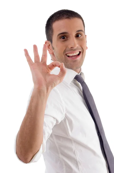 Young smiling man showing ok gesture — Stock Photo, Image