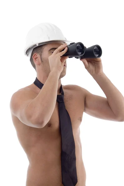 Architect looking through binoculars — Stock Photo, Image