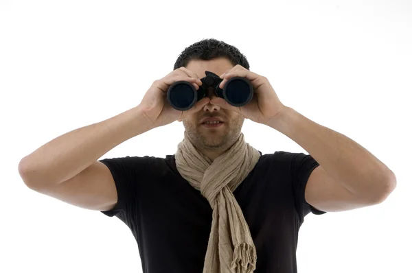 Portrait of man looking into binoculars — Stock Photo, Image