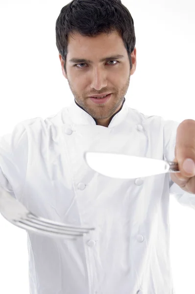 Çatal bıçak takımı tutan erkek aşçı portresi — Stok fotoğraf