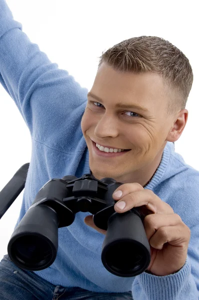 Smiling young man with binoculars — Stock Photo, Image