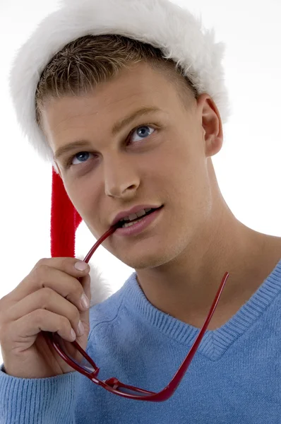 Christmas guy with sunglasses in mouth — Stock Photo, Image
