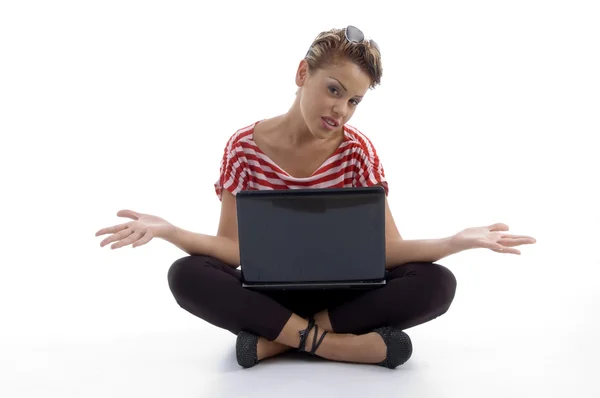 Sitting woman holding laptop, posing — Stock Photo, Image