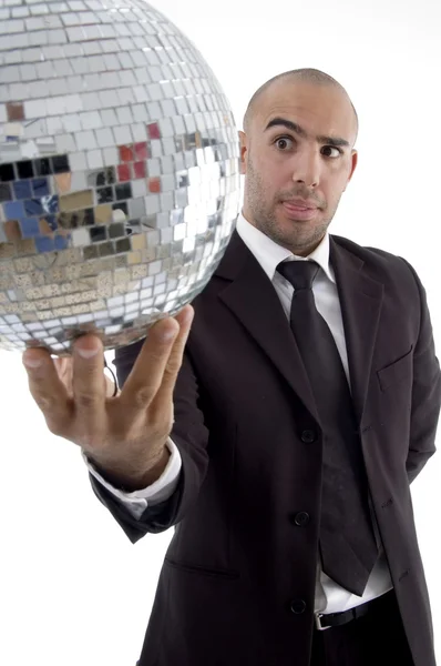 Young executive looking at disco ball — Stock Photo, Image