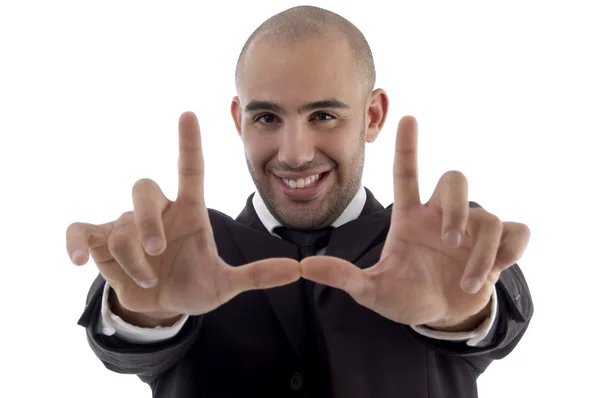 Homem corporativo jovem fazendo gesto quadro — Fotografia de Stock