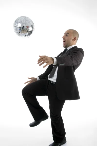 Corporate man playing with disco ball — Stock Photo, Image