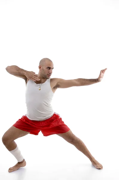 Sporty young male in fighting pose — Stock Photo, Image