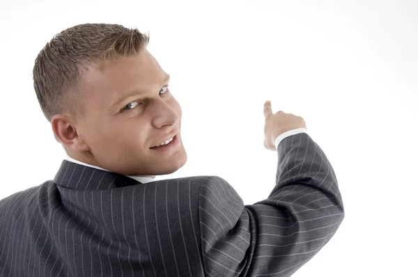 Smiling young manager pointing — Stock Photo, Image