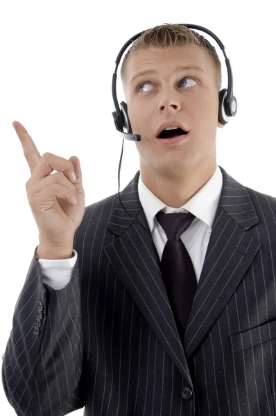 Young male executive pointing sideways — Stock Photo, Image