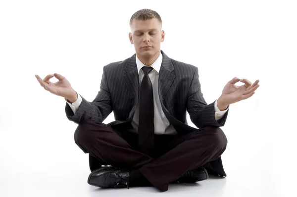 Handsome young executive practicing yoga — Stock Photo, Image