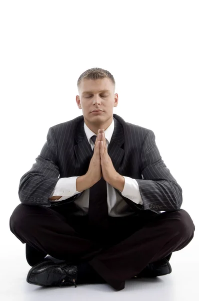 Knappe jongeman bidden — Stockfoto