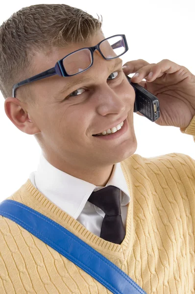 Lachende jonge student op telefoon — Stockfoto