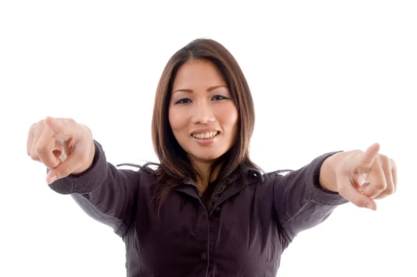 Young woman pointing with both hands — Stock Photo, Image
