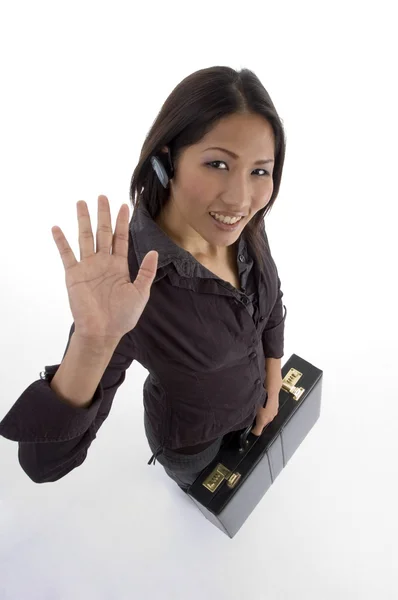 Businesswoman waving hand at camera — Stock Photo, Image