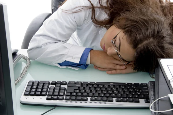 Sleeping young female doctor in clinic — Stock Photo, Image