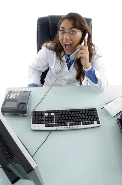 Female doctor answering call and smiling — Stock Photo, Image