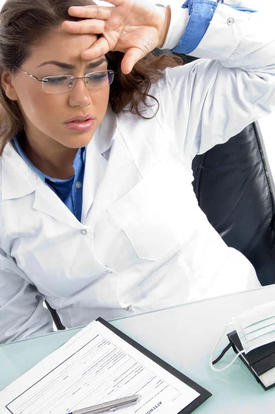 Female doctor in tension at workplace — Stock Photo, Image