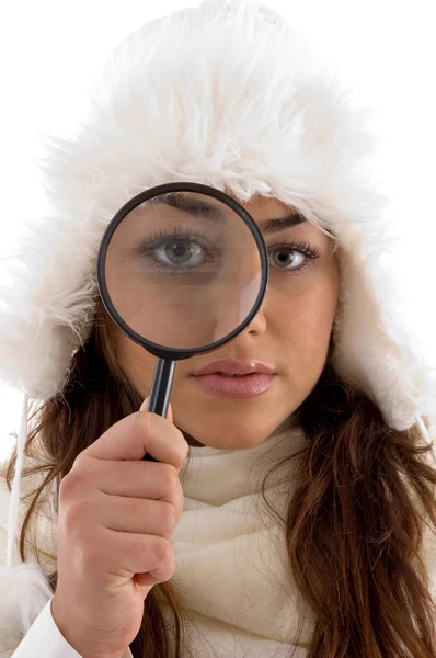 Female looking through magnifying glass — Stock Photo, Image