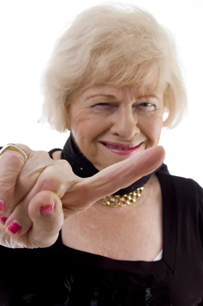 Portrait of cheerful old female pointing — Stock Photo, Image