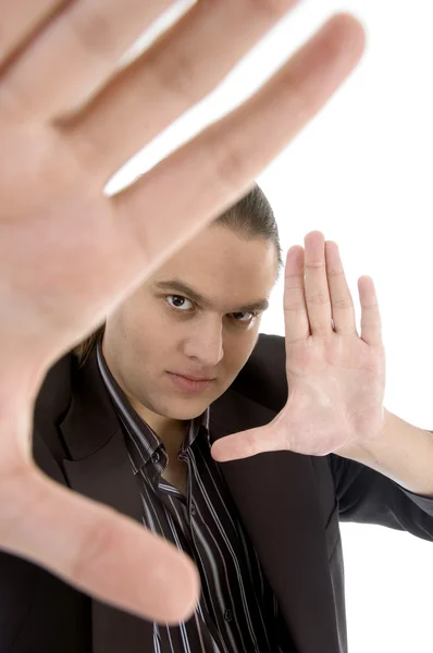 Businessman gesturing frame with hands Stock Picture