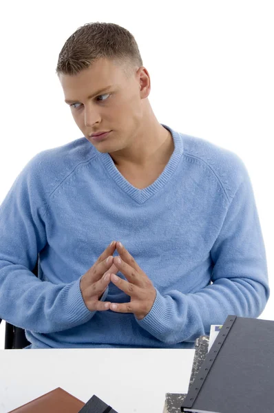 Young male sitting idle in office — Stock Photo, Image