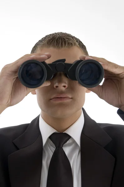 Empresario mirando a través de prismáticos Imagen De Stock