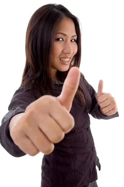 高兴的是女性与竖起大拇指 免版税图库照片