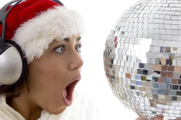 Surprised woman looking at disco ball — Stock Photo, Image