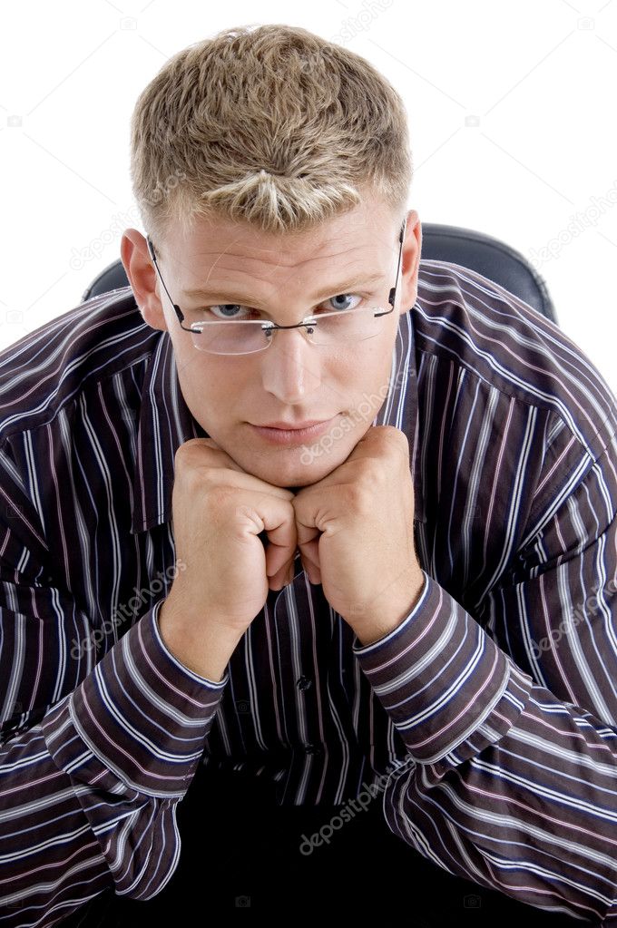 Businessman resting his chin on fists