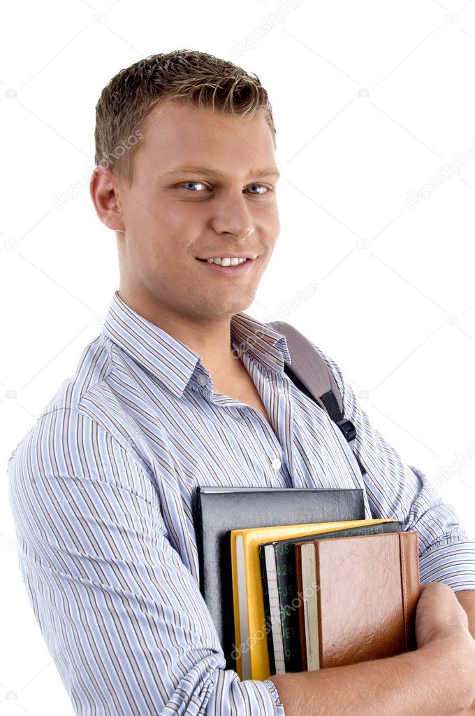 Portrait of student holding his books
