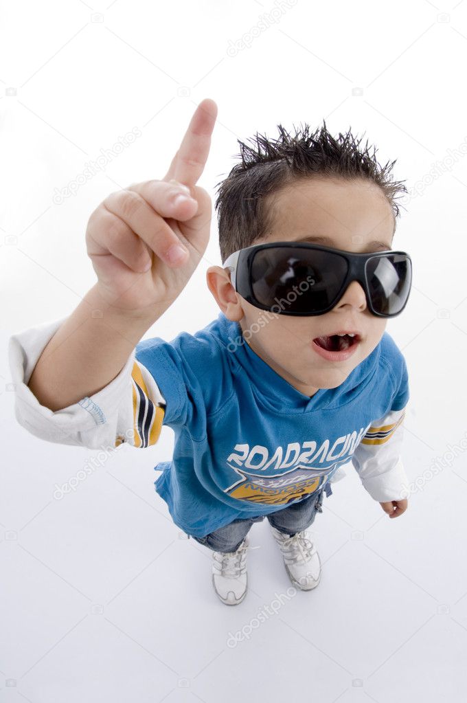 Pointing cute little boy with sunglasses