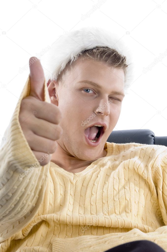 Man showing thumbs up with winking eye